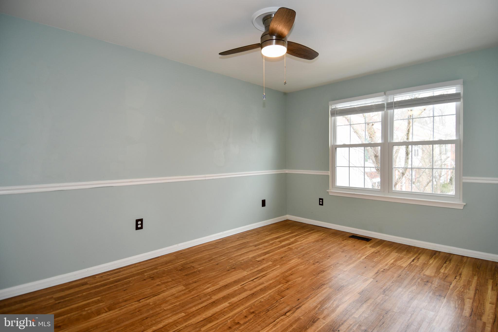 11796 Lone Tree Court Columbia, MD 21044 - Photo 25 of 45 a view of empty room with wooden floor and fan