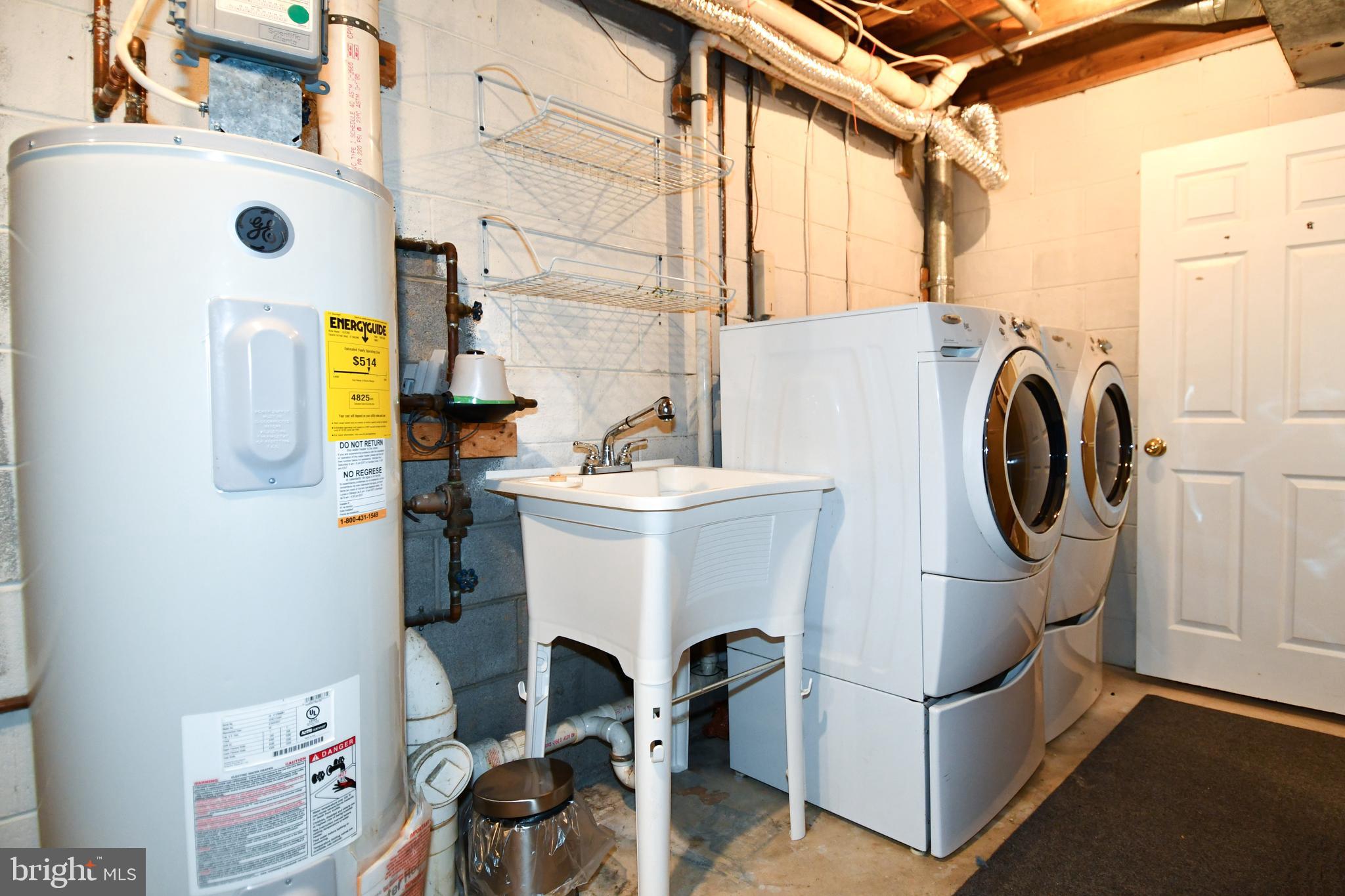 11796 Lone Tree Court Columbia, MD 21044 - Photo 34 of 45 a utility room with dryer and washer