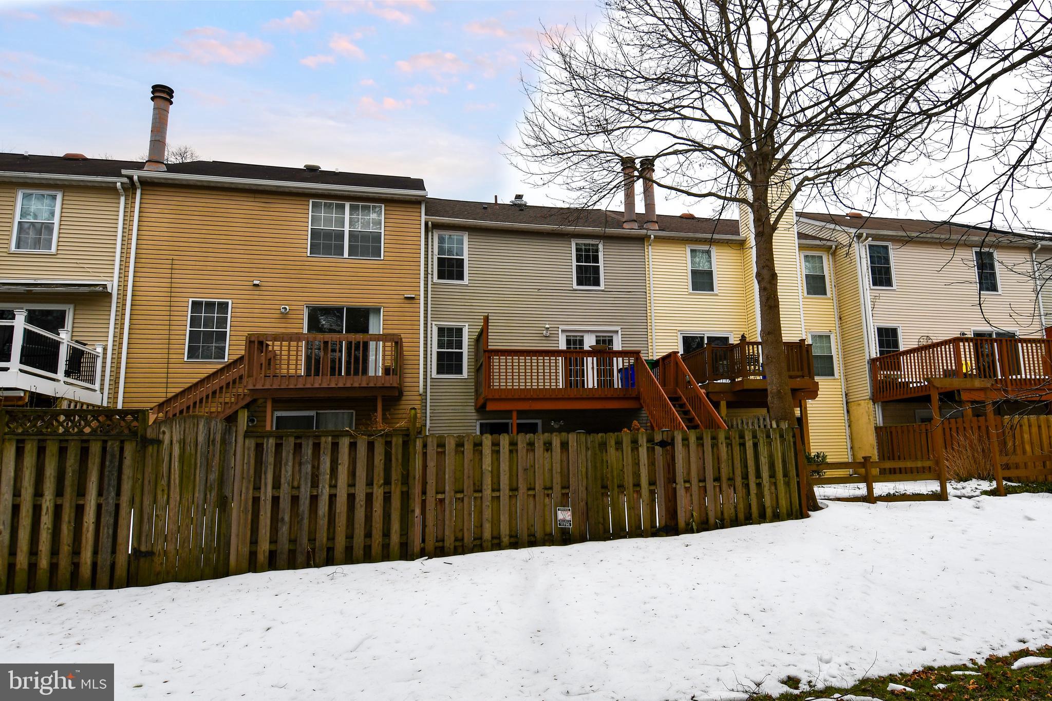 11796 Lone Tree Court Columbia, MD 21044 - Photo 38 of 45 a view of a house with a wooden fence