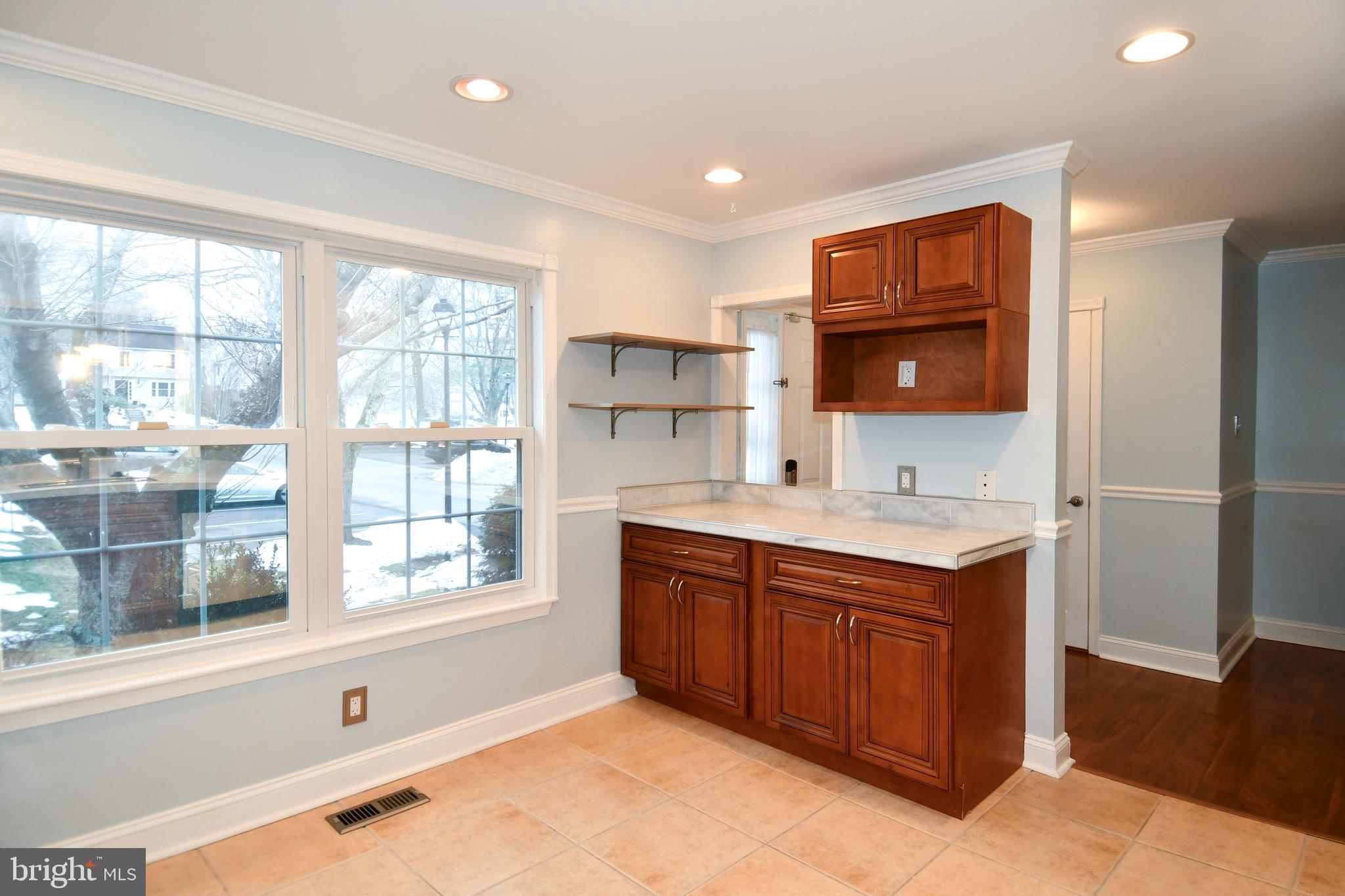 11796 Lone Tree Court Columbia, MD 21044 - Photo 5 of 45 a kitchen with stainless steel appliances granite countertop a sink and a stove top oven