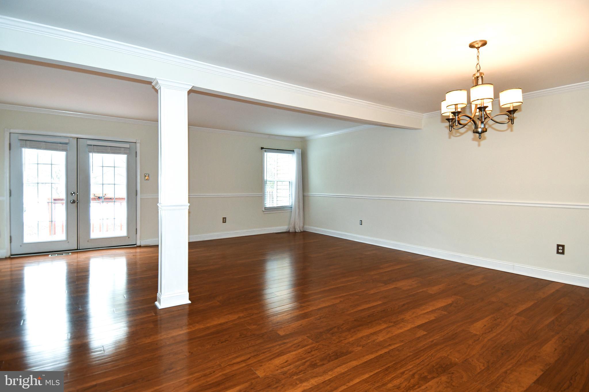 11796 Lone Tree Court Columbia, MD 21044 - Photo 7 of 45 wooden floor in an empty room with a window