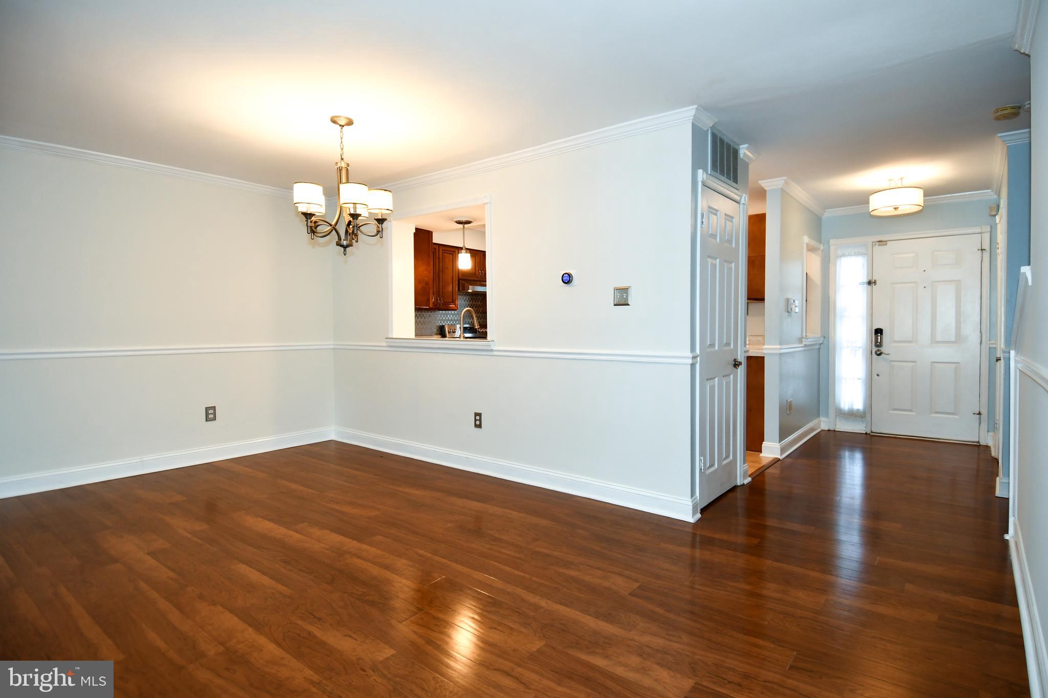 11796 Lone Tree Court Columbia, MD 21044 - Photo 9 of 45 an empty room with wooden floor