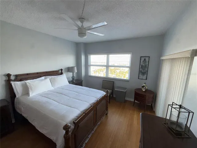 a bedroom with two beds and a large window