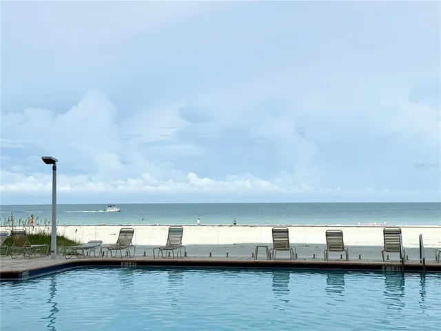 a view of swimming pool with chairs