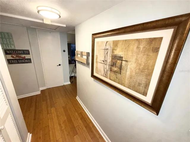 a living room with a floor to ceiling window and a floor to ceiling window