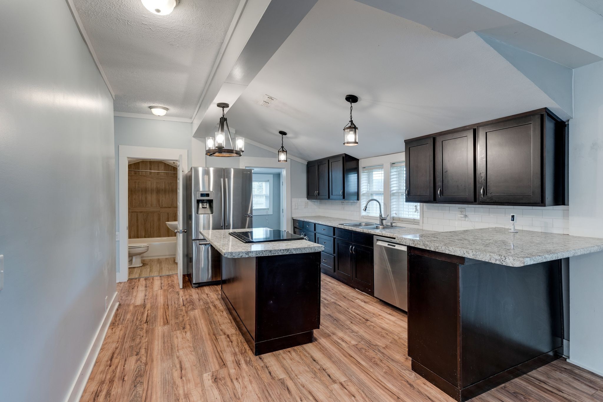 101 Fairfield Road Bethpage, TN 37022 - Photo 11 of 35 a kitchen with stainless steel appliances granite countertop a sink stove and refrigerator