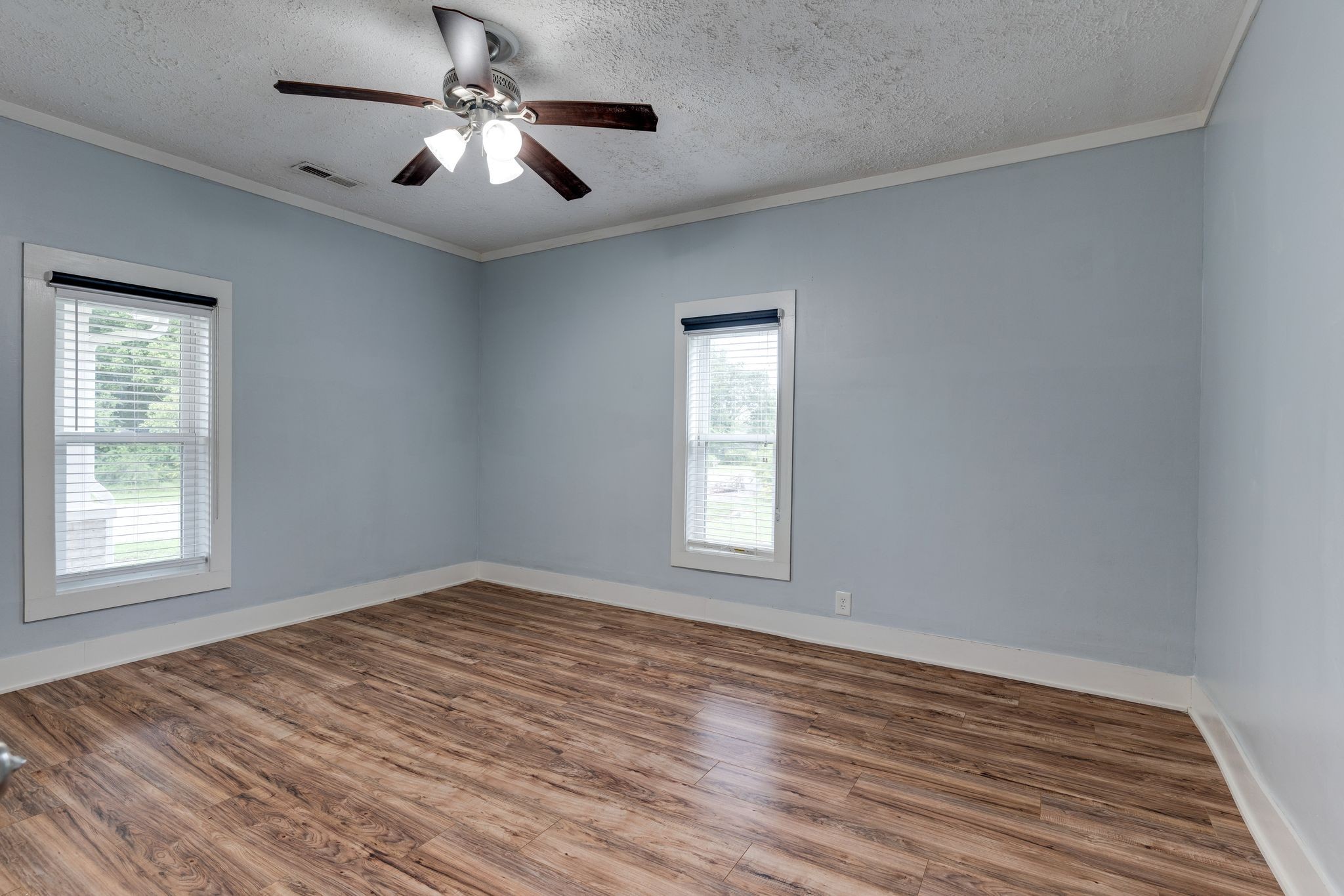 101 Fairfield Road Bethpage, TN 37022 - Photo 16 of 35 a view of empty room with wooden floor and fan