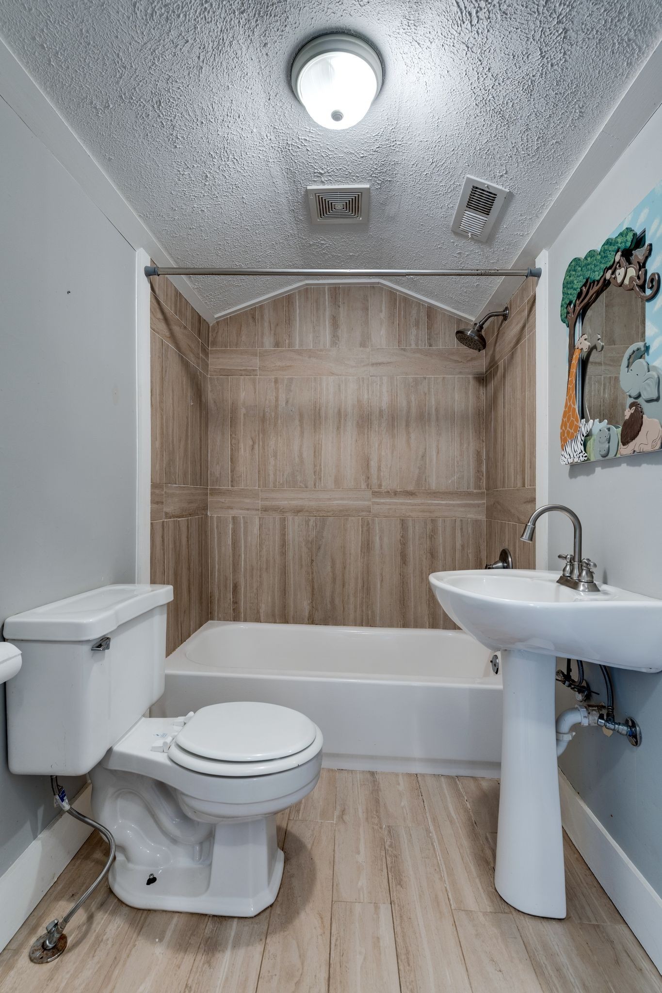 101 Fairfield Road Bethpage, TN 37022 - Photo 20 of 35 a white toilet sitting next to a bathroom sink