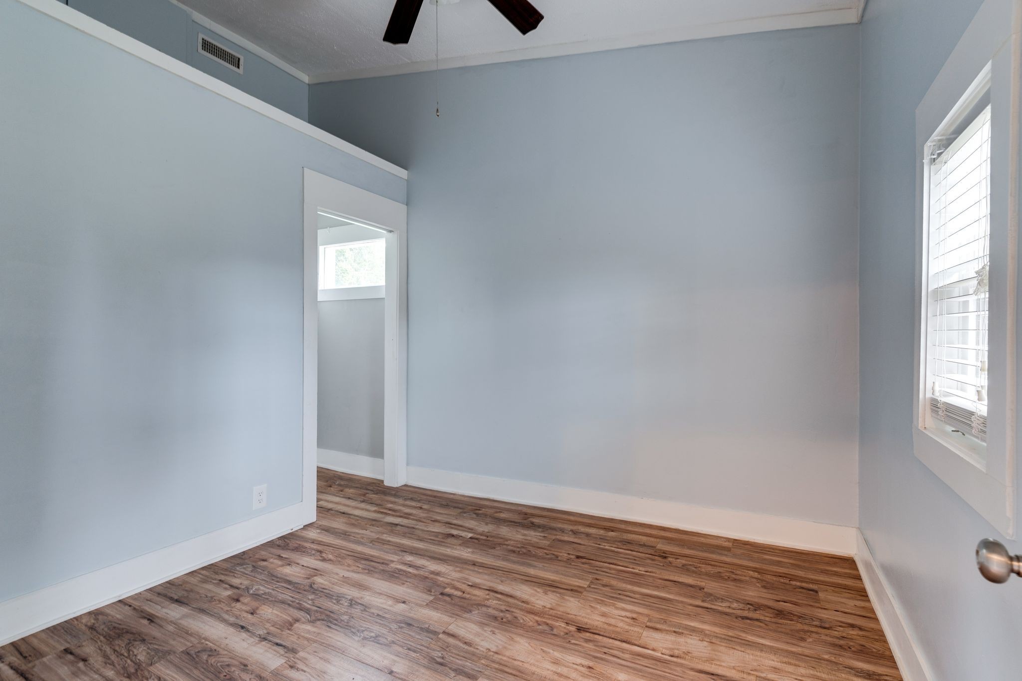 101 Fairfield Road Bethpage, TN 37022 - Photo 24 of 35 an empty room with wooden floor and windows