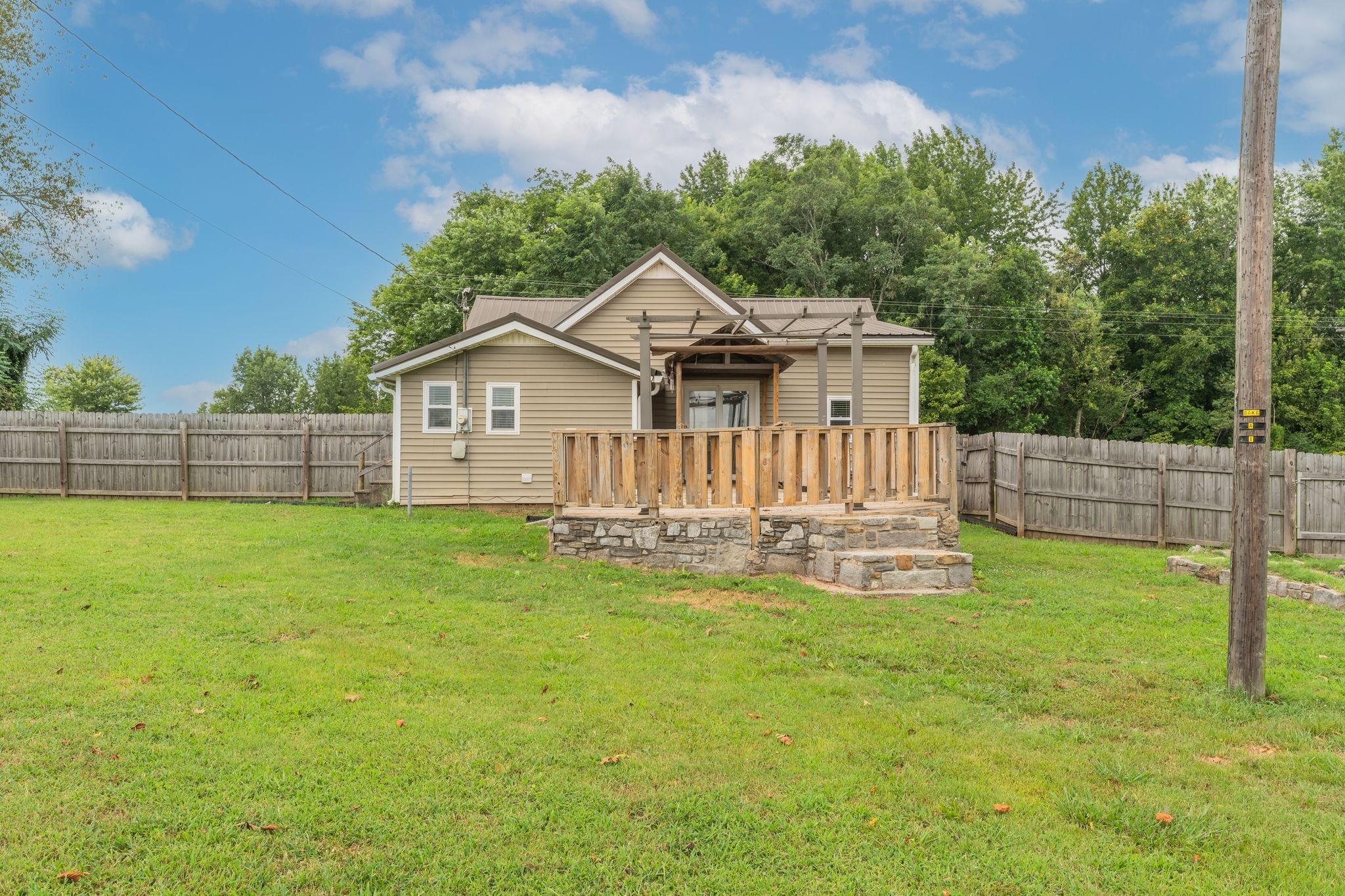 101 Fairfield Road Bethpage, TN 37022 - Photo 31 of 35 a view of a house with a big yard and large trees