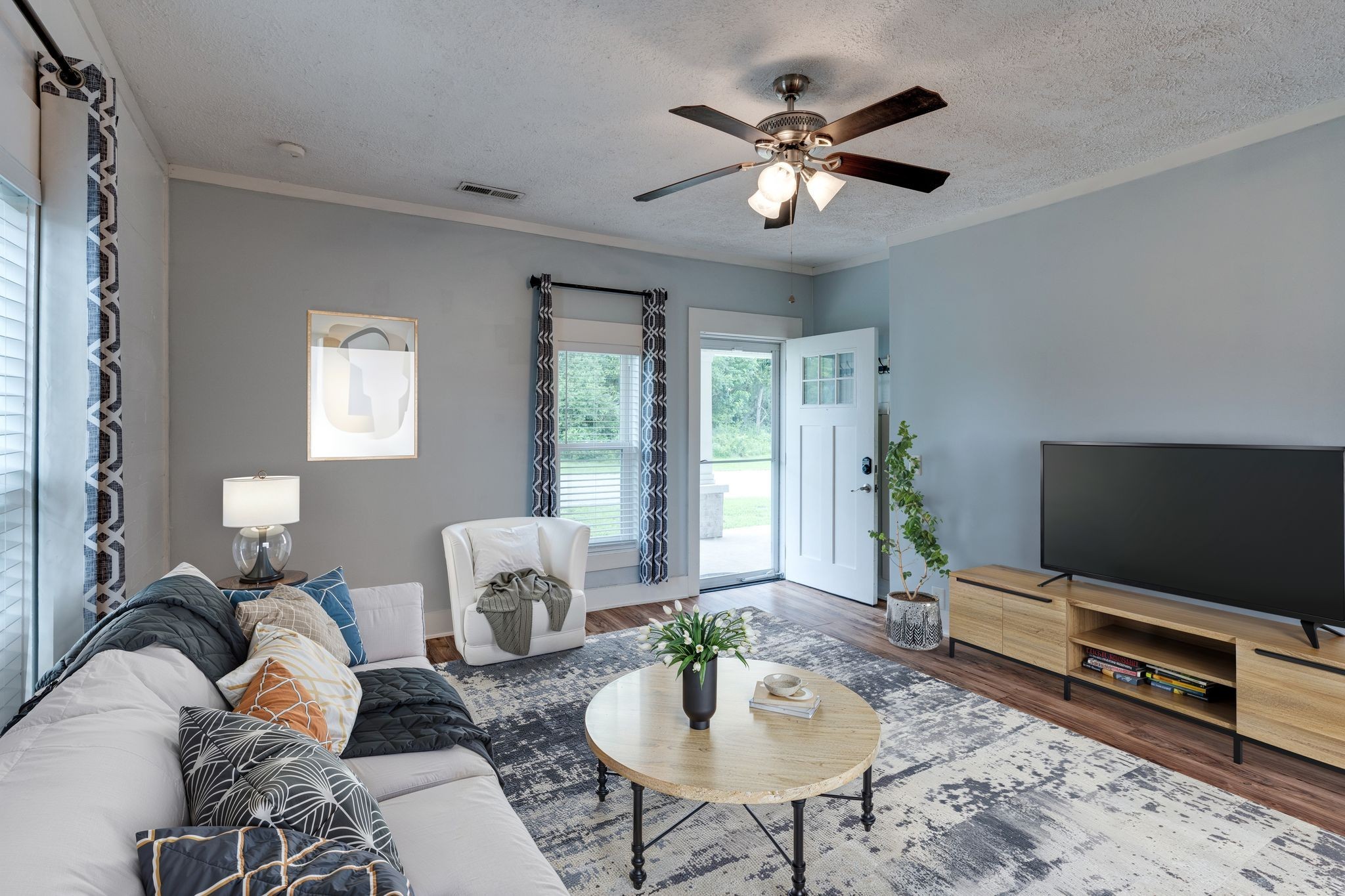 101 Fairfield Road Bethpage, TN 37022 - Photo 9 of 35 a living room with furniture a flat screen tv and a large window