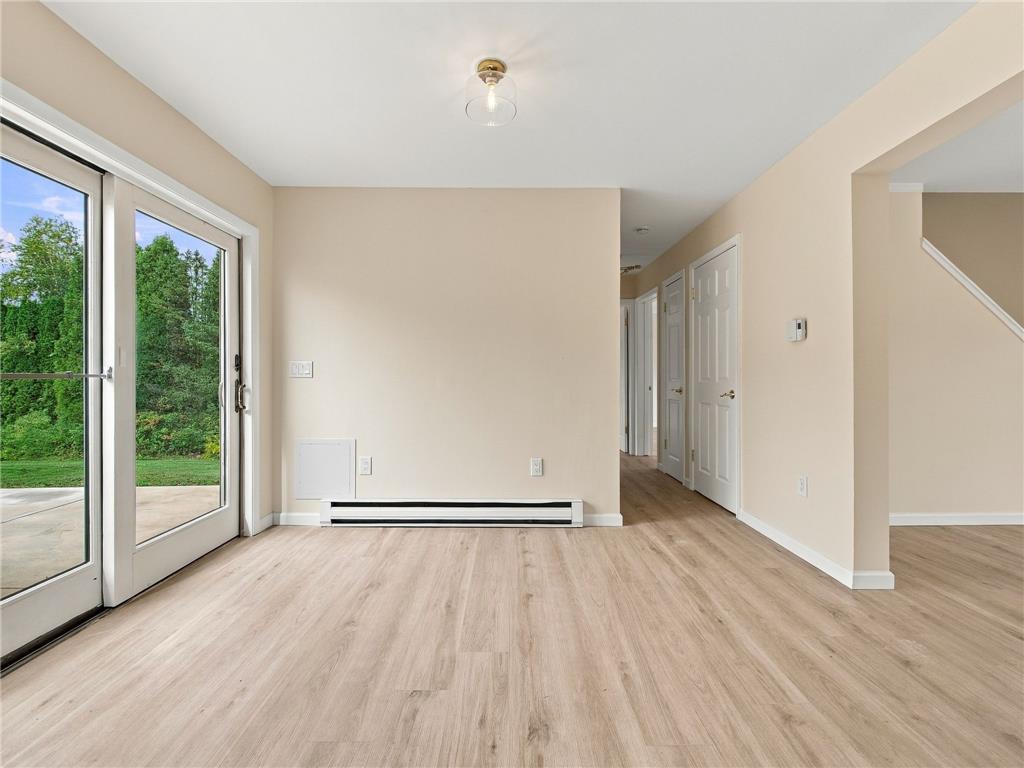 90 Gun Club Road Palmerton, PA 18071 - Photo 35 of 58 Sliding glass doors open to the outdoors, filling this wood-floored space with natural light.