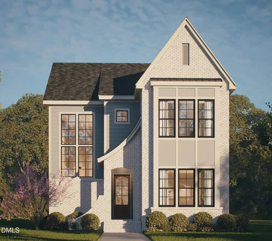 a front view of a house with plants