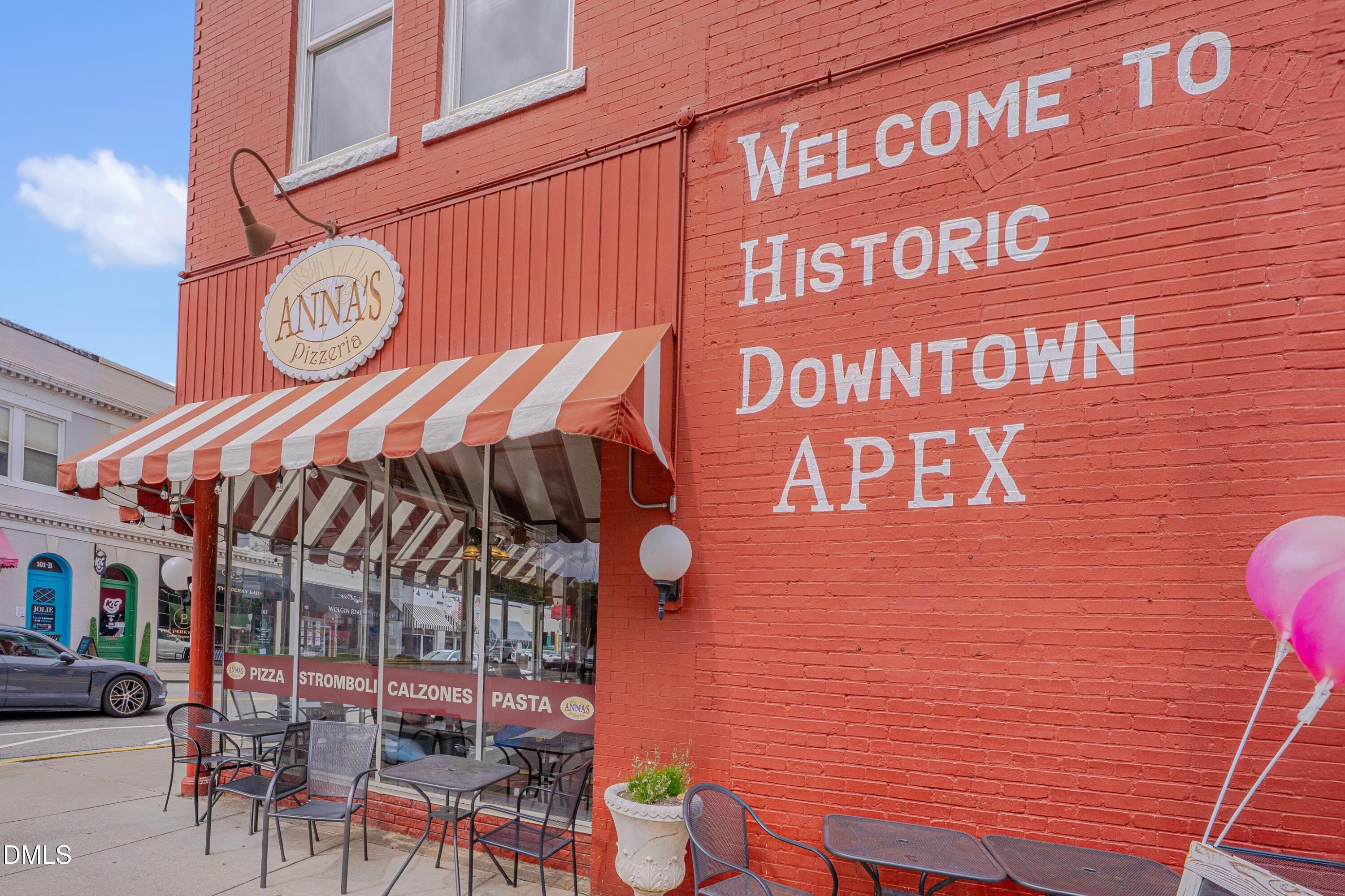 309 Culvert Street Apex, NC 27502 - Photo 4 of 15 a view of a cafe with a couple of table and chairs