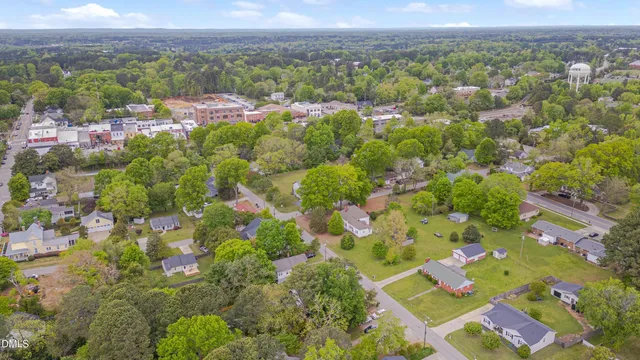 an aerial view of a residential houses with outdoor space