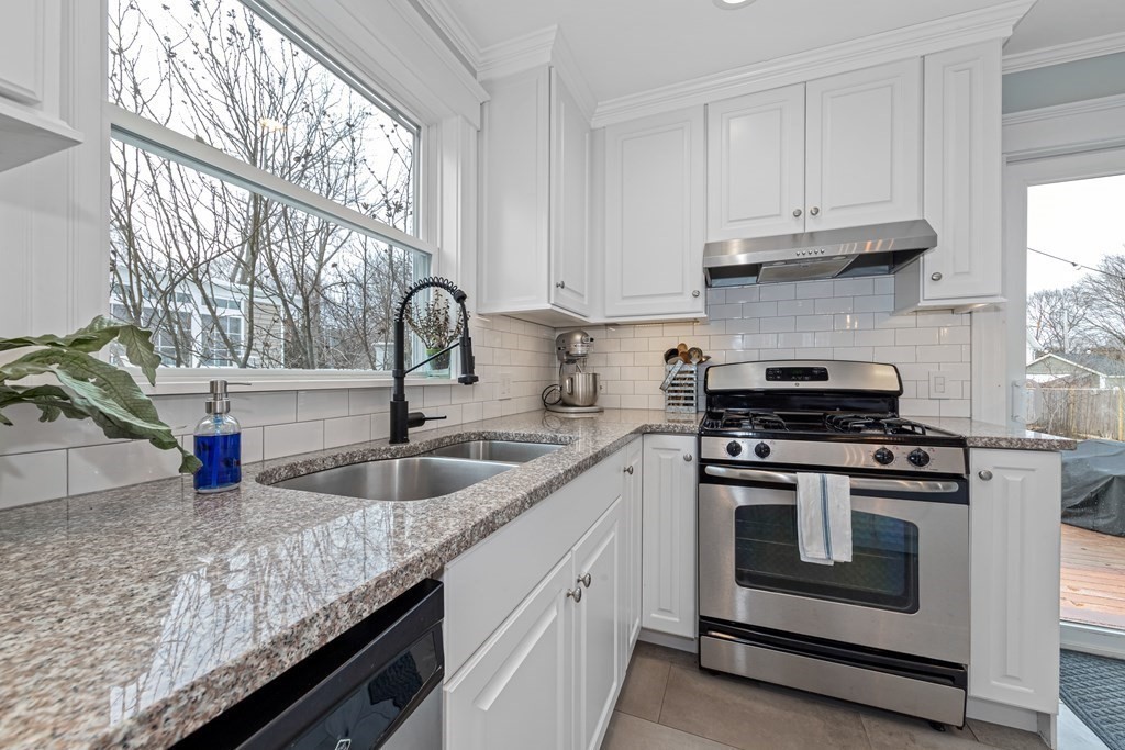 6 Storey Avenue Newburyport, MA 01950 - Photo 15 of 41 a kitchen with granite countertop a sink stainless steel appliances and window