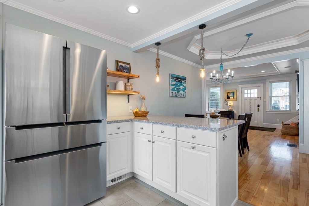 6 Storey Avenue Newburyport, MA 01950 - Photo 16 of 41 a kitchen with stainless steel appliances a refrigerator sink and cabinets