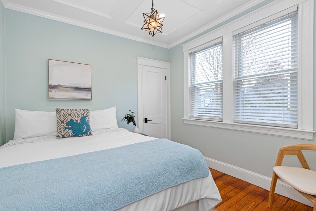 6 Storey Avenue Newburyport, MA 01950 - Photo 19 of 41 a bedroom with a bed and a chair