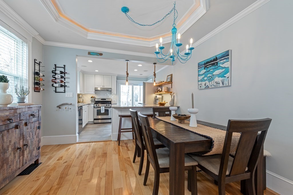 6 Storey Avenue Newburyport, MA 01950 - Photo 20 of 41 a view of a dining room with furniture wooden floor and chandelier
