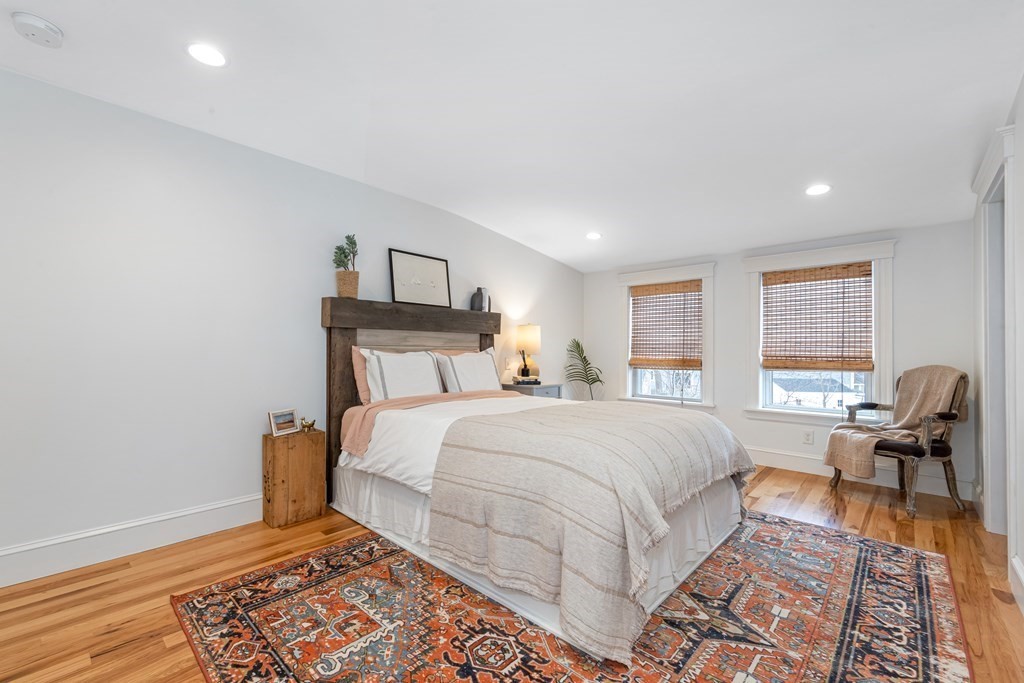 6 Storey Avenue Newburyport, MA 01950 - Photo 22 of 41 a bedroom with a bed and wooden floor