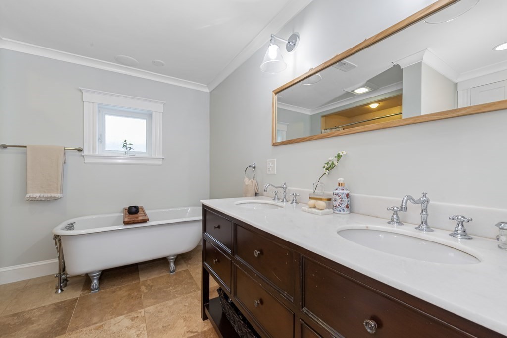 6 Storey Avenue Newburyport, MA 01950 - Photo 25 of 41 a en suite bathroom with a double vanity sink and a mirror
