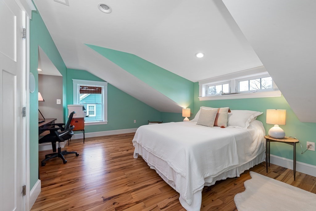 6 Storey Avenue Newburyport, MA 01950 - Photo 28 of 41 a bedroom with a bed and wooden floor