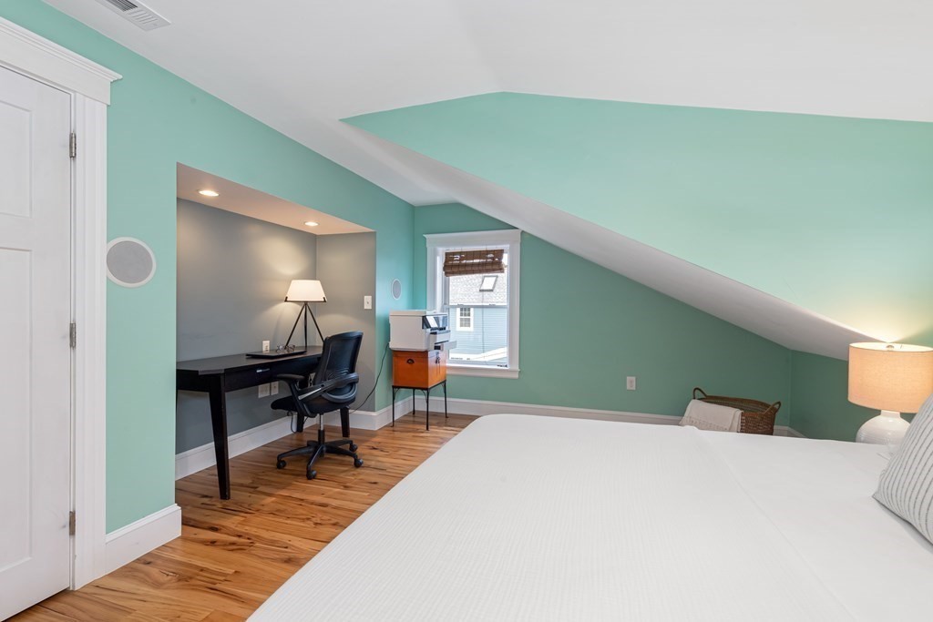 6 Storey Avenue Newburyport, MA 01950 - Photo 29 of 41 a bedroom with a bed and a table in it