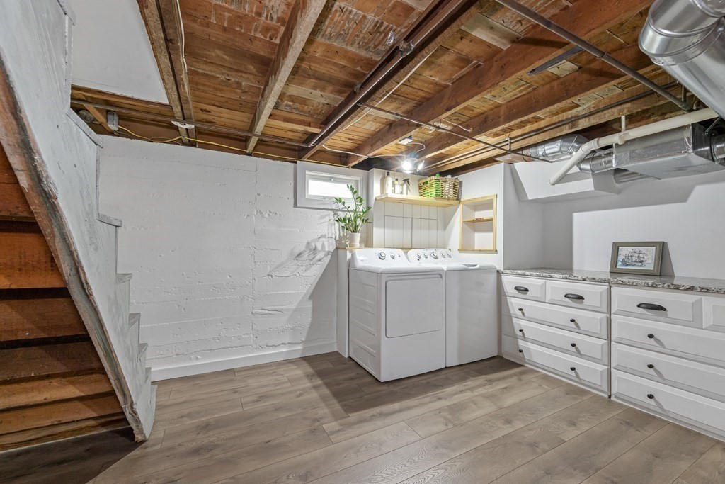 6 Storey Avenue Newburyport, MA 01950 - Photo 31 of 41 a utility room with cabinets dryer and washer