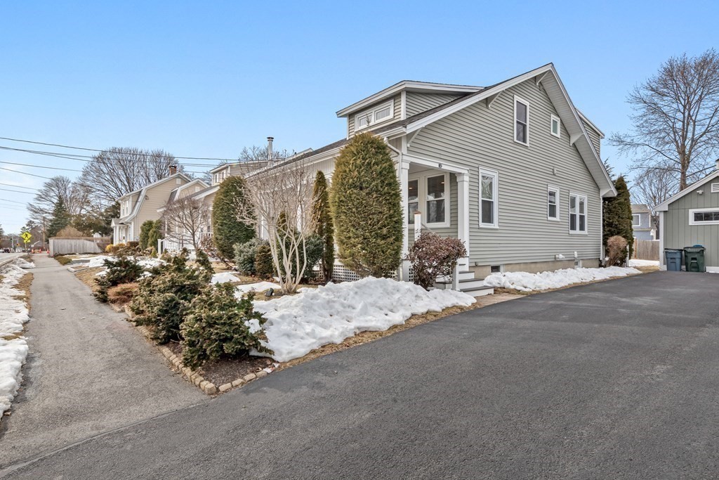 6 Storey Avenue Newburyport, MA 01950 - Photo 35 of 41 a front view of a house with a yard and garage