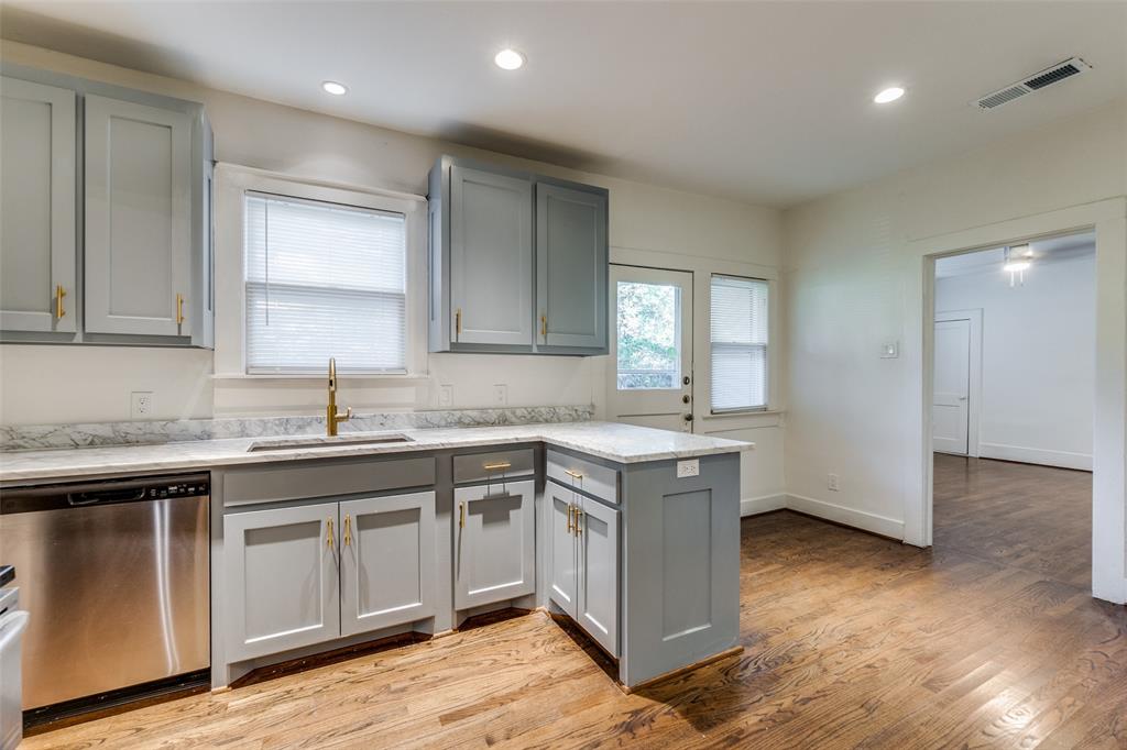 732 North Windomere Avenue Dallas, TX 75208 - Photo 14 of 33 a kitchen with a sink cabinets and wooden floor