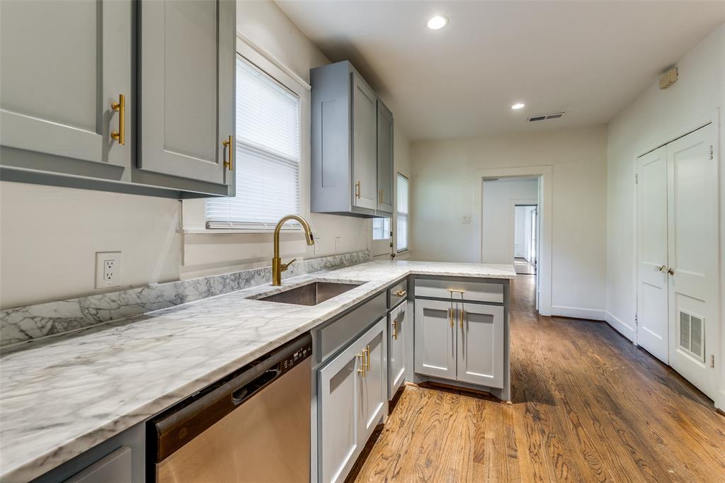 732 North Windomere Avenue Dallas, TX 75208 - Photo 15 of 33 a kitchen with a sink stove top oven and cabinets