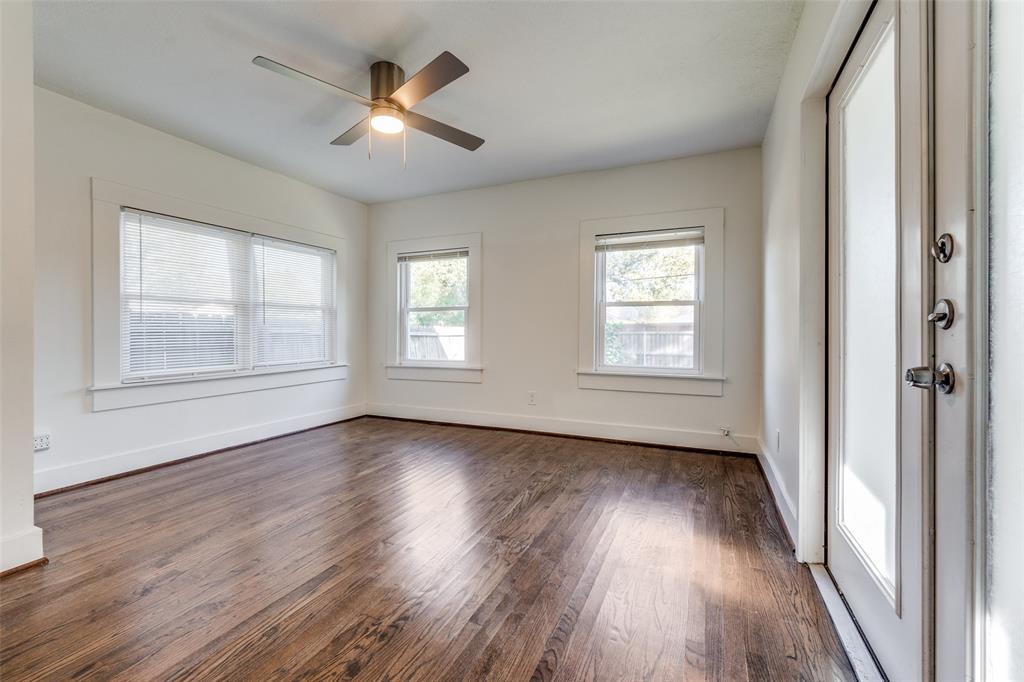 732 North Windomere Avenue Dallas, TX 75208 - Photo 22 of 33 a view of an empty room with wooden floor and a window