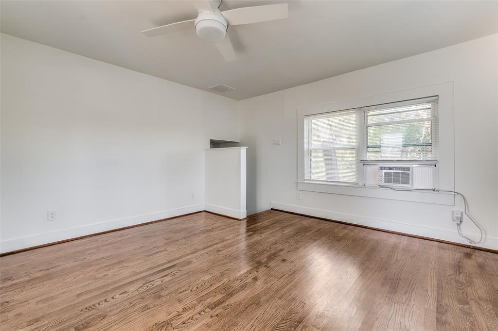 732 North Windomere Avenue Dallas, TX 75208 - Photo 24 of 33 an empty room with wooden floor and windows