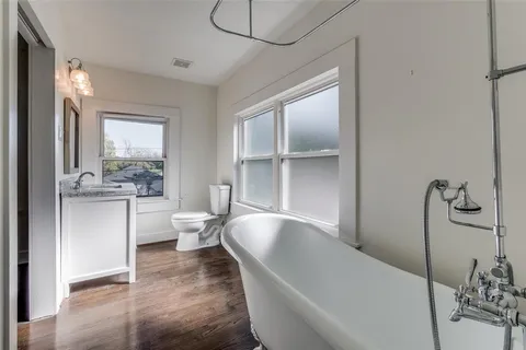 a living room with furniture and white walls