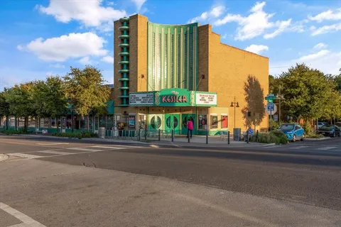a view of a building with a street
