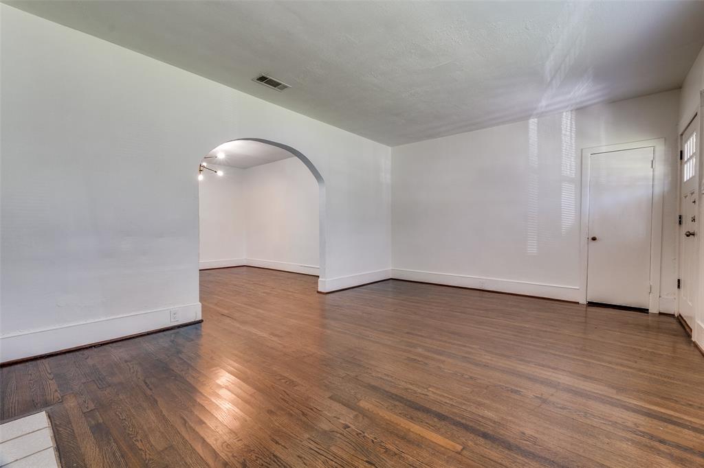 732 North Windomere Avenue Dallas, TX 75208 - Photo 7 of 33 a view of an empty room with wooden floor