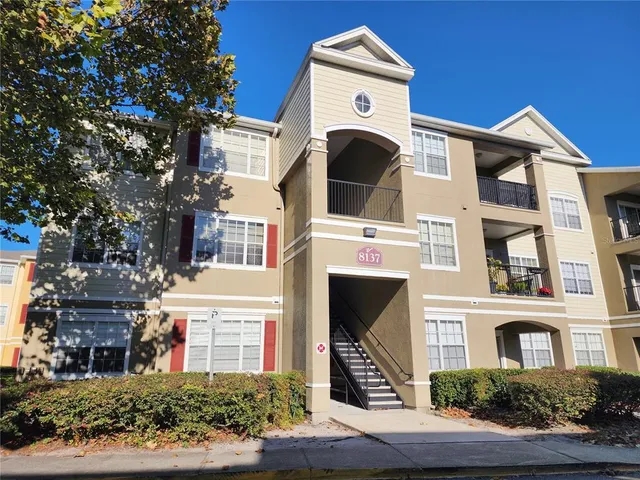 a living room with fireplace furniture and a wooden floor