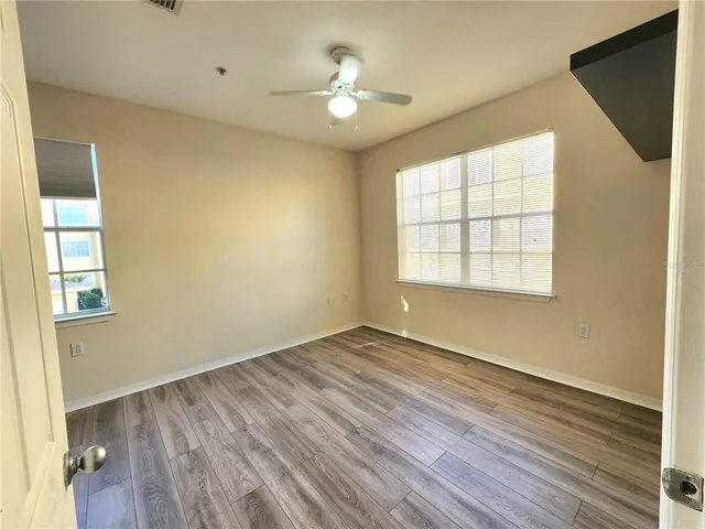 a front view of a house with swimming pool having outdoor seating