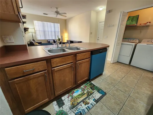 a bathroom with a sink toilet tub and shower