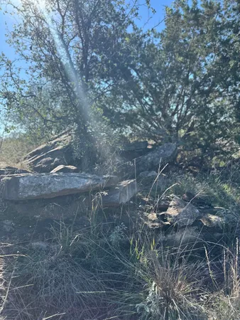 a view of mountain with sunset