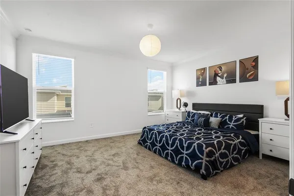 a bedroom with a bed and window