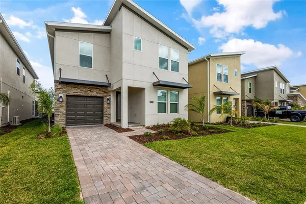 a front view of a house with a yard