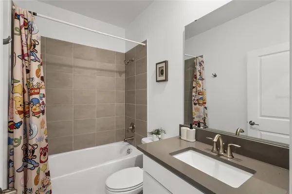 a bathroom with a sink a toilet and a bathtub