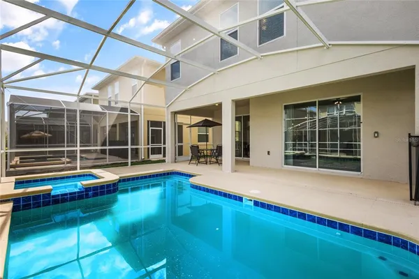 a view of swimming pool with seating area