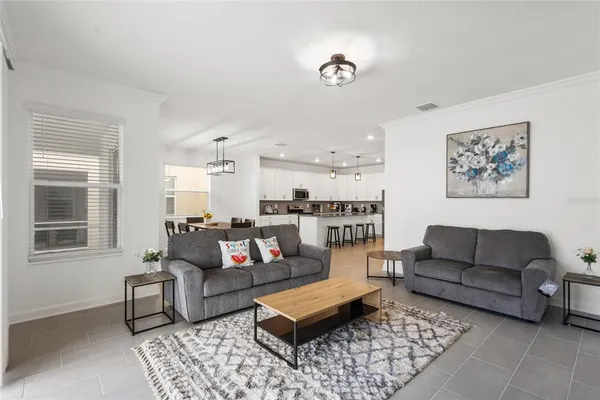 a living room with furniture and a rug