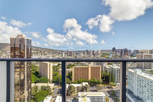 a view of a balcony with wooden floor