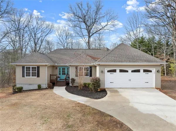 a front view of a house with yard