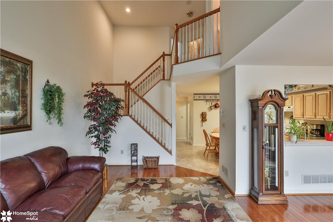 507 Howertown Road Northampton, PA 18067 - Photo 14 of 46 A grand staircase with rich wooden banisters anchors this airy, naturally illuminated entryway.