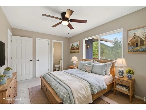 a bedroom with a large bed and a window