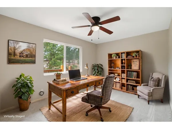 a workspace with furniture and a potted plant